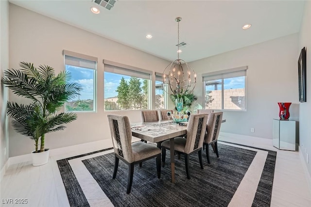 dining area featuring a notable chandelier