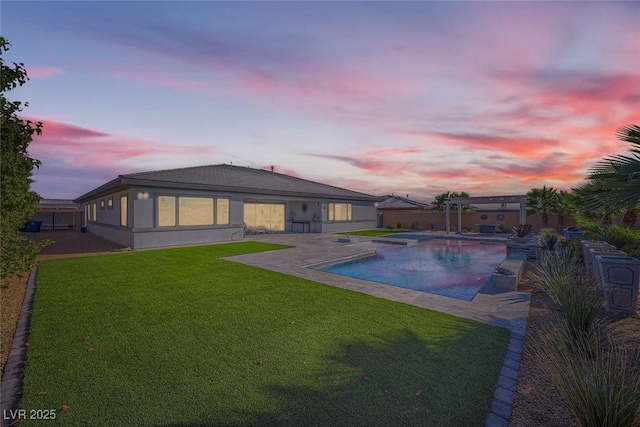 pool at dusk with a yard, a pergola, and a patio