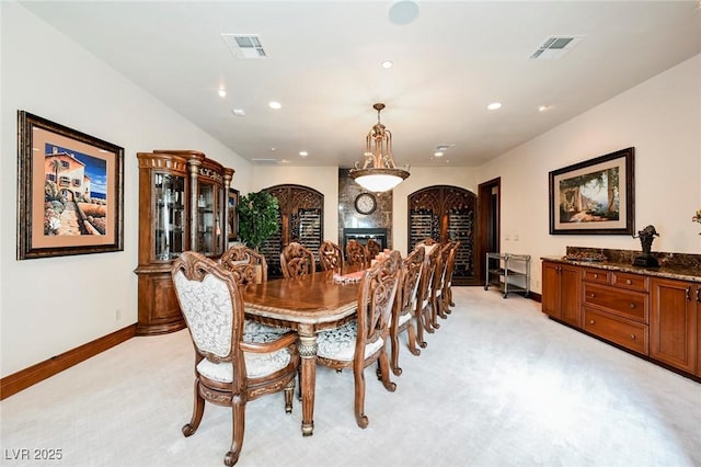 dining room featuring light carpet