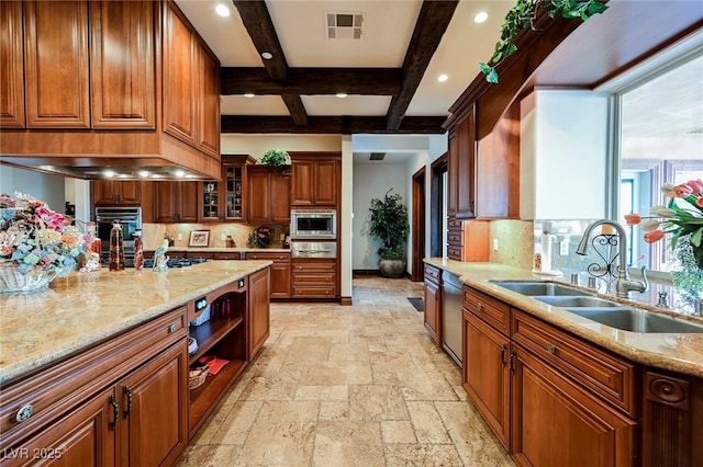 kitchen featuring sink, light stone counters, stainless steel appliances, beam ceiling, and backsplash