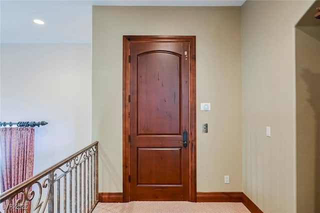 corridor with carpet flooring