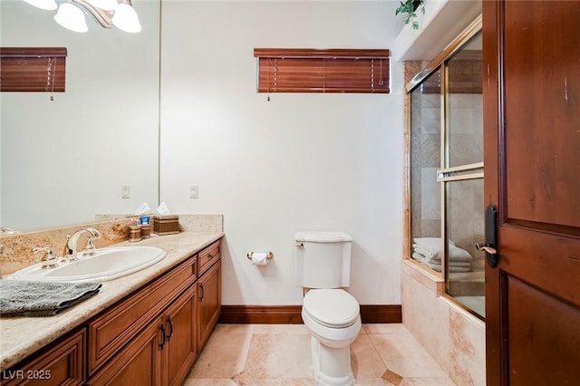 full bathroom with tile patterned flooring, enclosed tub / shower combo, vanity, and toilet