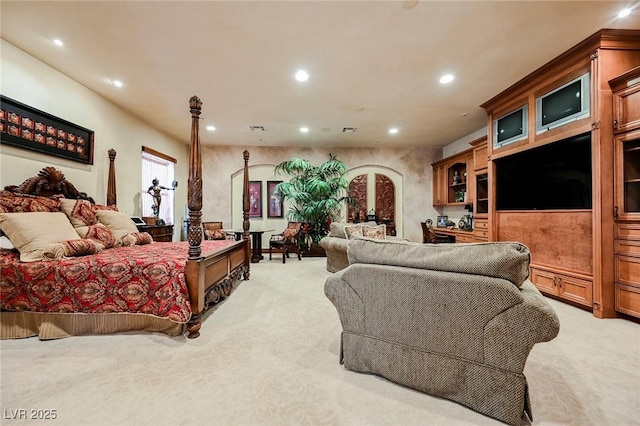 carpeted bedroom with ornate columns