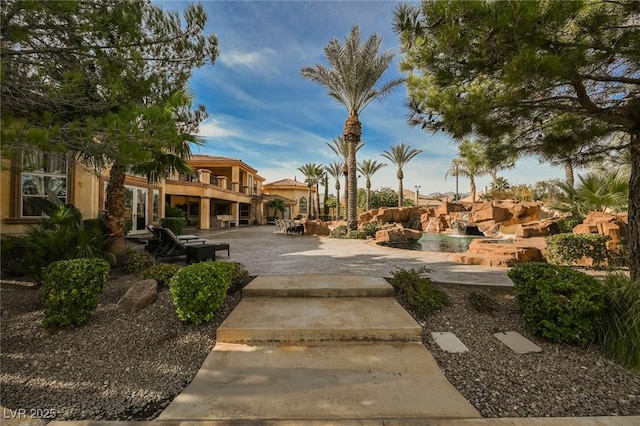 surrounding community featuring a patio area