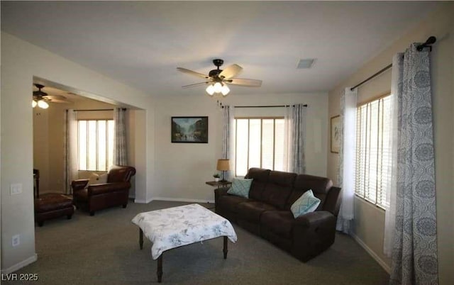 living room with carpet flooring and ceiling fan