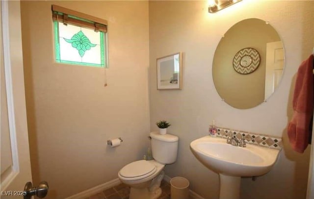 bathroom featuring toilet and sink