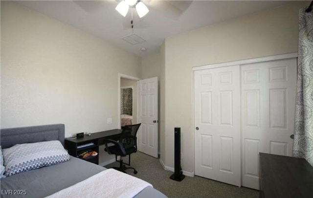 carpeted bedroom featuring ceiling fan and a closet