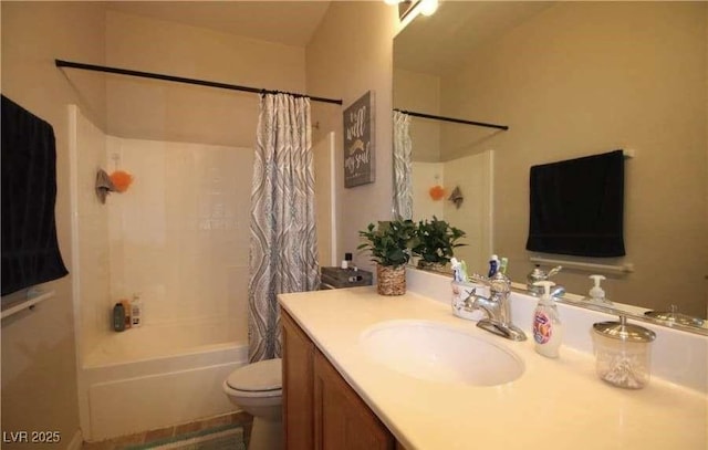 full bathroom featuring vanity, shower / tub combo, and toilet