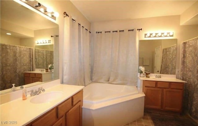 bathroom with vanity and a bathtub