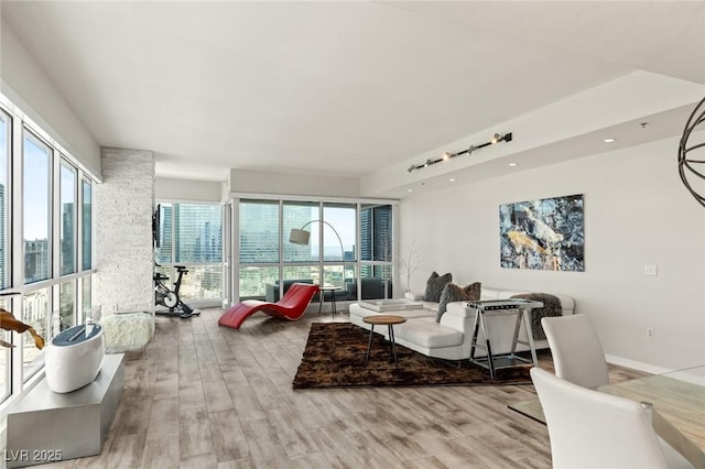 living room with wood finished floors and recessed lighting