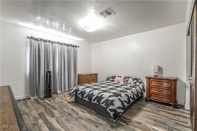 bedroom featuring dark wood-type flooring