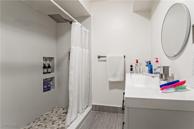 bathroom with vanity and walk in shower