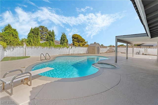 view of swimming pool featuring a shed, a patio, and a diving board