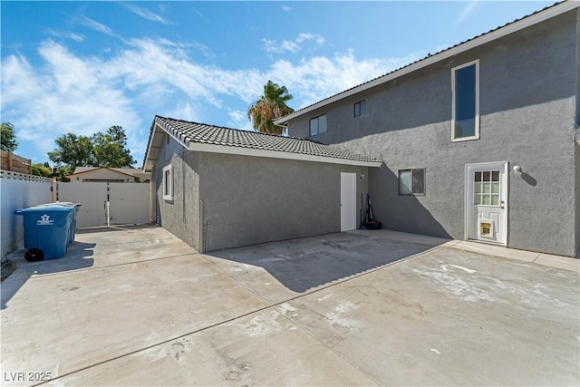 rear view of house with a patio