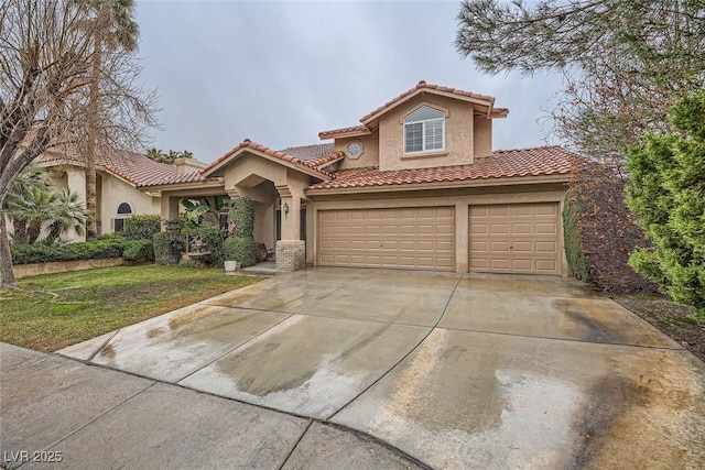 mediterranean / spanish home with a garage and a front lawn