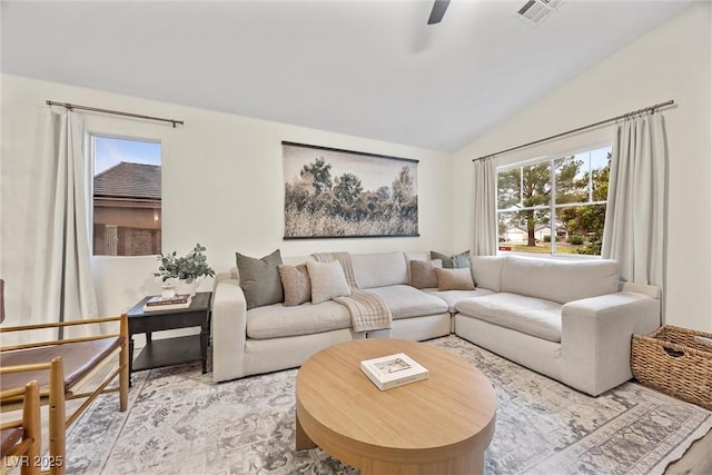 living room featuring vaulted ceiling, ceiling fan, and light wood-type flooring