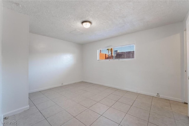 empty room featuring a textured ceiling