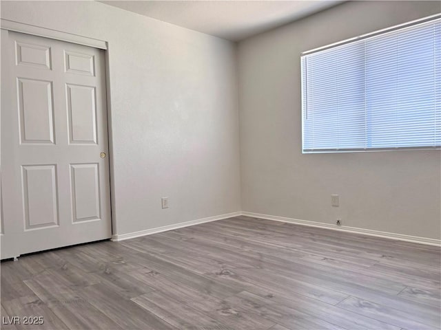 unfurnished room featuring light hardwood / wood-style floors