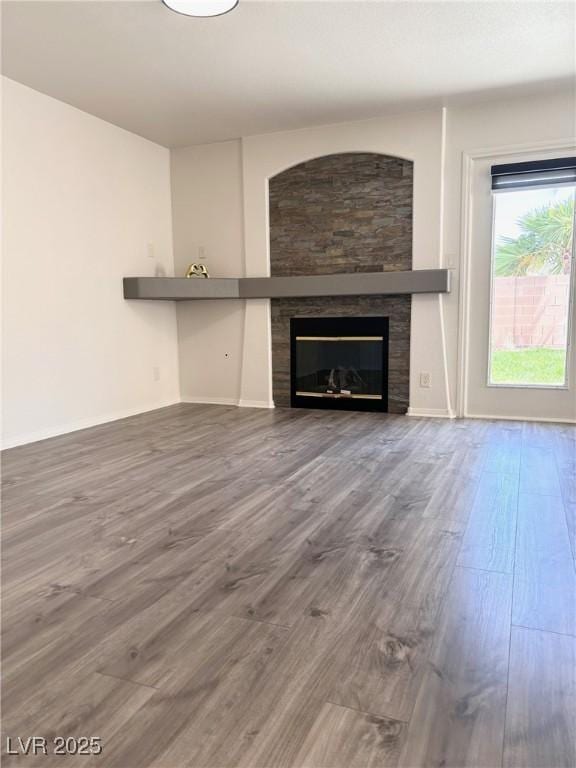 unfurnished living room with wood-type flooring