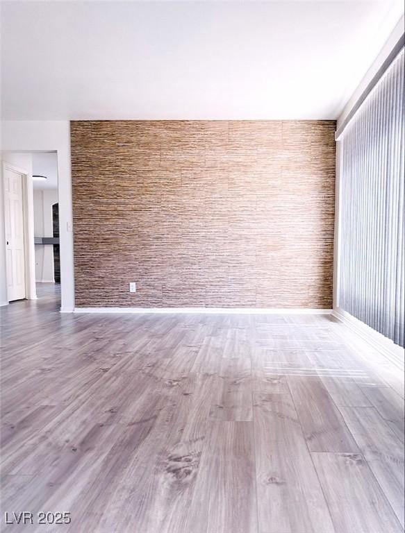 spare room featuring hardwood / wood-style floors