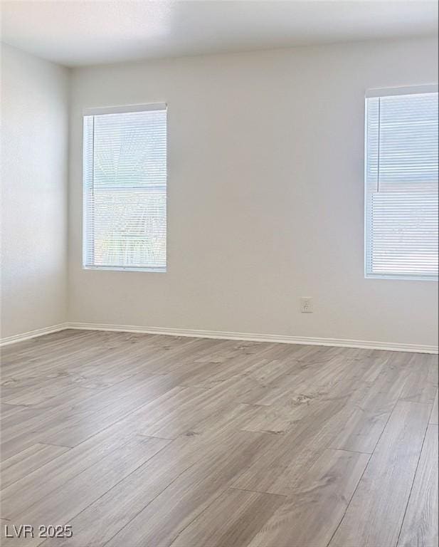 spare room featuring light hardwood / wood-style flooring