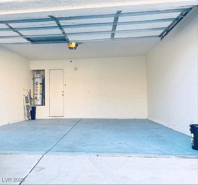 garage with water heater and a garage door opener