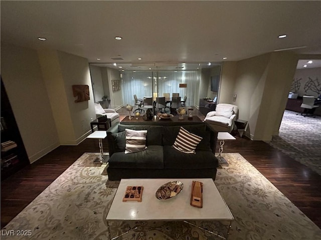 living area featuring wood finished floors and recessed lighting