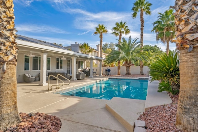 view of swimming pool with a patio area