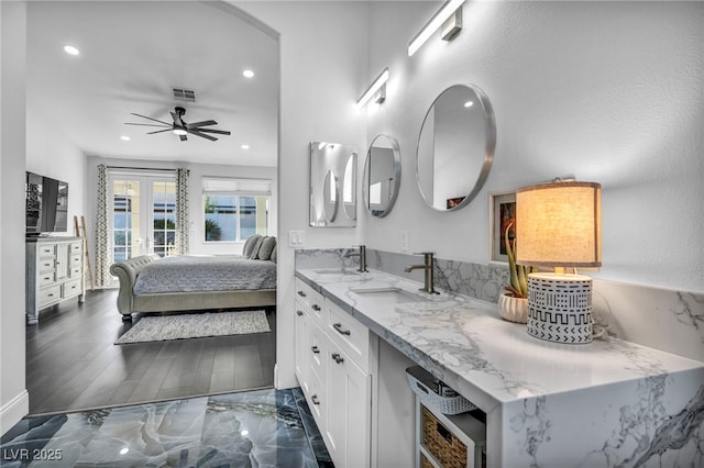 bathroom featuring vanity, hardwood / wood-style floors, and ceiling fan