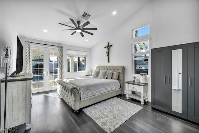 bedroom with french doors, dark hardwood / wood-style floors, multiple windows, and access to outside