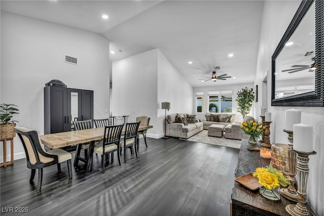 dining space with lofted ceiling, dark hardwood / wood-style floors, and ceiling fan