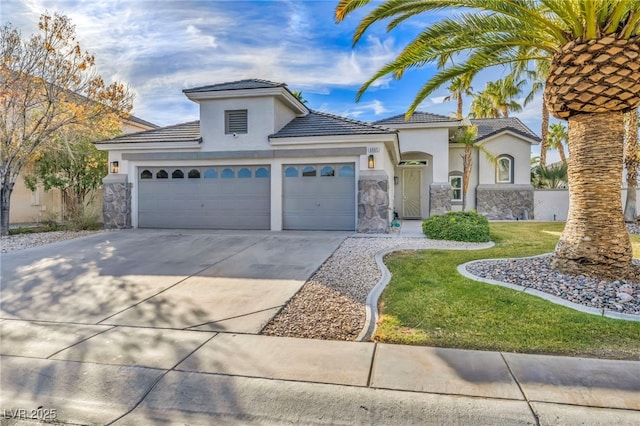 view of front facade with a garage and a front lawn