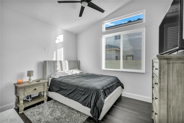 bedroom featuring lofted ceiling, dark hardwood / wood-style floors, and ceiling fan