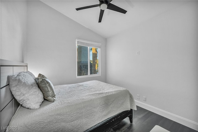 bedroom featuring hardwood / wood-style flooring, vaulted ceiling, and ceiling fan