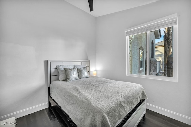 bedroom featuring dark hardwood / wood-style flooring