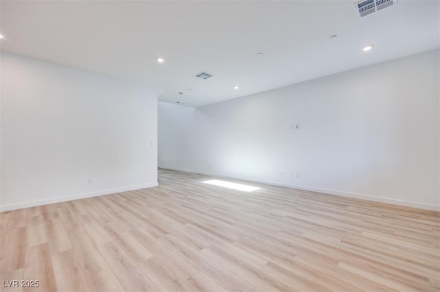 unfurnished room featuring light hardwood / wood-style floors