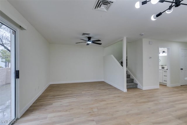 spare room featuring ceiling fan and light hardwood / wood-style floors