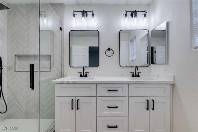 bathroom featuring vanity and an enclosed shower