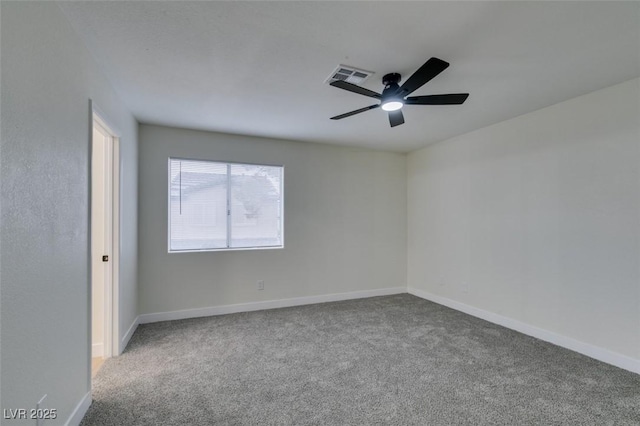 carpeted empty room featuring ceiling fan