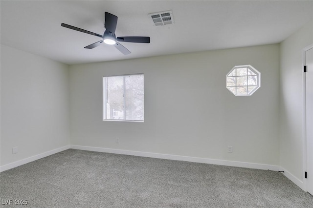 carpeted empty room with ceiling fan