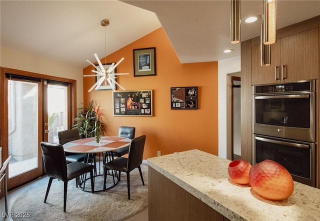 dining room featuring vaulted ceiling