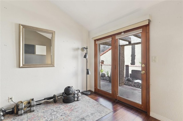 entryway featuring vaulted ceiling, baseboards, dark wood finished floors, and french doors