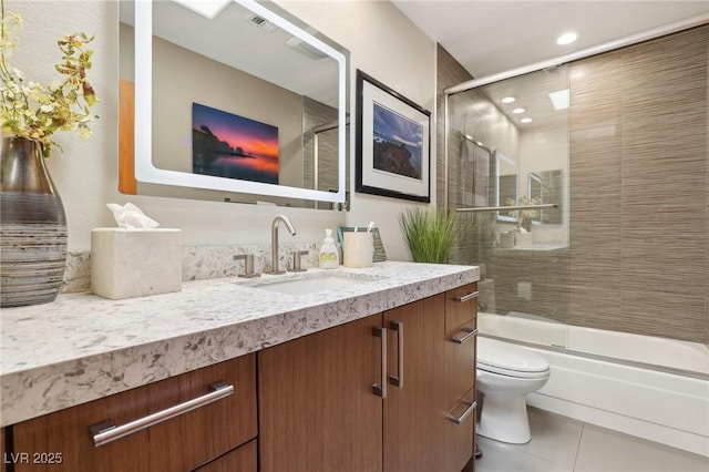 bathroom featuring tile patterned flooring, toilet, recessed lighting, bath / shower combo with glass door, and vanity