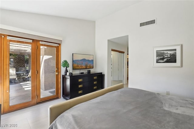 bedroom featuring access to exterior, french doors, and visible vents