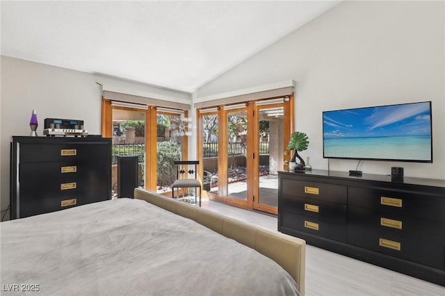 bedroom featuring access to outside and vaulted ceiling