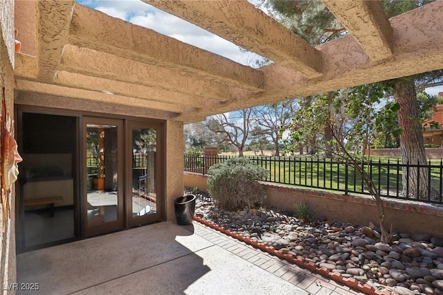 view of patio / terrace with french doors and fence