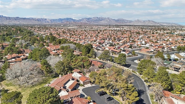 drone / aerial view featuring a residential view and a mountain view