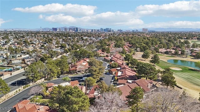 birds eye view of property featuring a view of city and golf course view