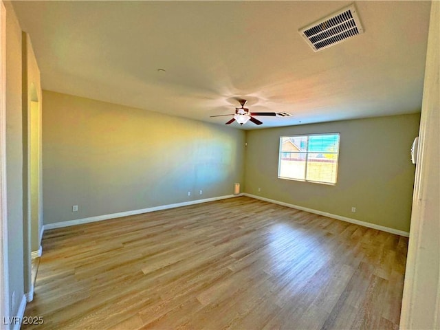 unfurnished room with light wood-type flooring and ceiling fan