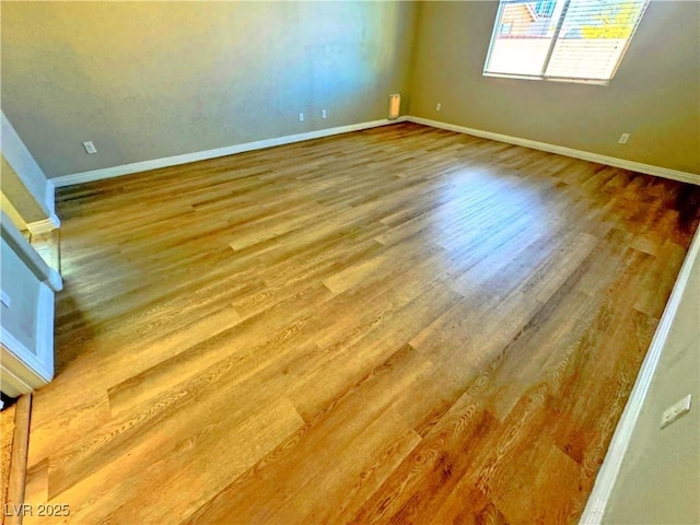 spare room with hardwood / wood-style flooring